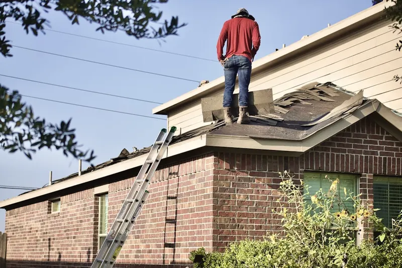 Professional roofer working on a residential roof in Seven Palms Mobile Home Estates